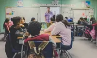 Classroom teaching scene representing teacher updates and resource changes.