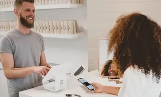 Payment terminal and card context representing payment phishing risk.